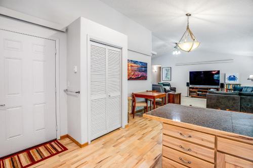 a kitchen with a door leading to a living room at Netarts Getaway in Tillamook