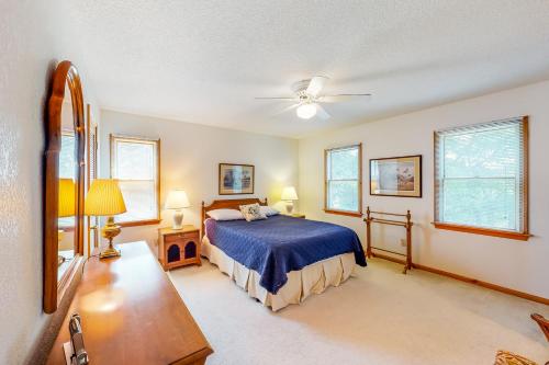 a bedroom with a bed and a ceiling fan at May's Landing FOBB365 in Frisco