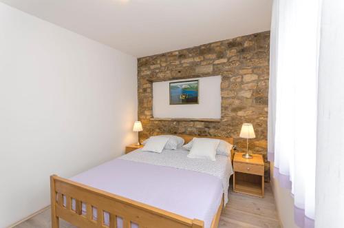 Postel nebo postele na pokoji v ubytování Apartment Luka