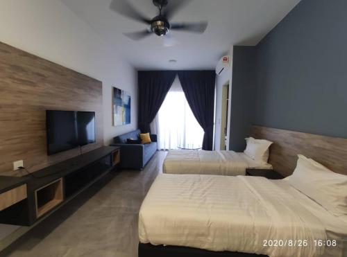 Katil atau katil-katil dalam bilik di Homestay Shah Rizki at Imperio with swimming pool muslim friendly
