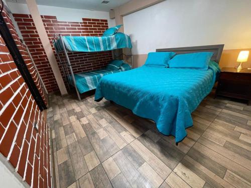 Кровать или кровати в номере Hostal Los Salares