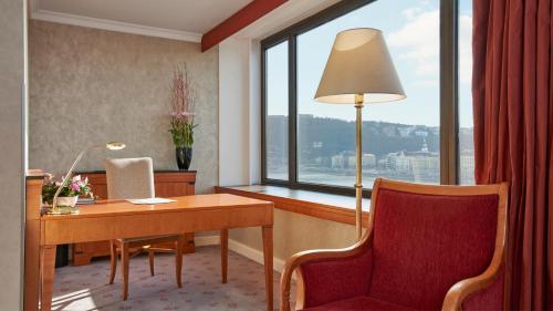 a room with a desk and a chair and a window at InterContinental Budapest by IHG in Budapest