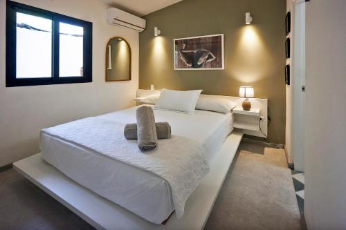 Ένα ή περισσότερα κρεβάτια σε δωμάτιο στο Villa Taleona