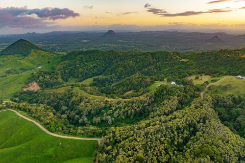 an aerial view of a green valley with trees at Rosecliffe Boutique Farm Cottages in Pomona