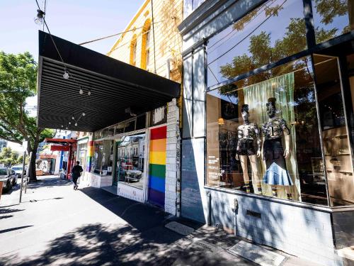 a store front with a colorful display window on a street at lyf Collingwood Melbourne in Melbourne
