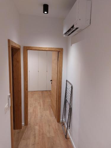 an empty room with a door and a hallway at Casa Gray 2 in Koper