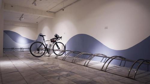 a bike parked against a wall in a room at Su Ao Hotel in Suao