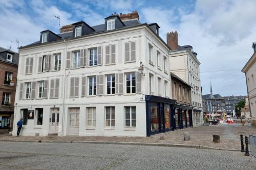 a white building on the side of a street at Hypolite 1 New - Cocooning flat - 80 meters from the Port of Honfleur in Honfleur