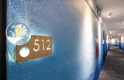 a lightswitch on a blue wall in a hallway at King Hot Spring Hotel in Jiaoxi