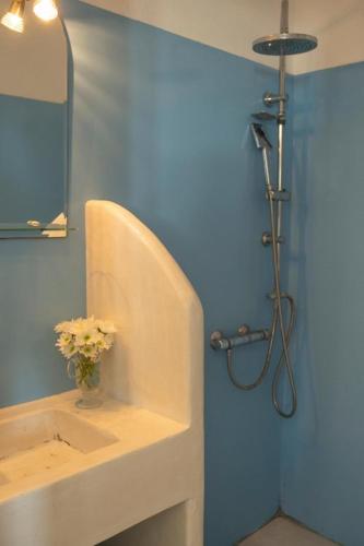 a bathroom with a sink and a shower at Anatoli in Ambelas