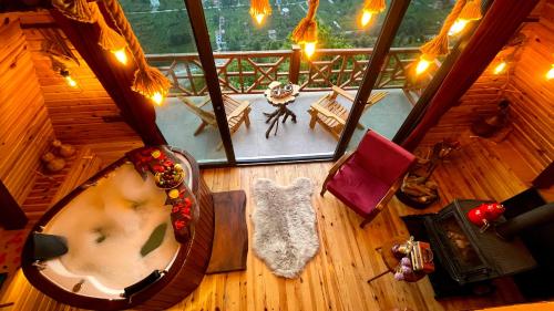 an overhead view of a room with a tub in a house at RizeHayatburdabungalov in Ardeşen