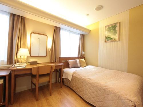 Cama o camas de una habitación en Tottori Onsen Hotel Monarque Tottori