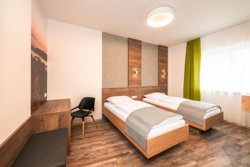 Un pat sau paturi într-o cameră la Das schlaf&GUT - Self Check-In