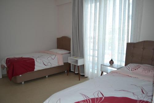 Giường trong phòng chung tại Antalya belek Mermaid villas 3 bedrooms close the beach park 2