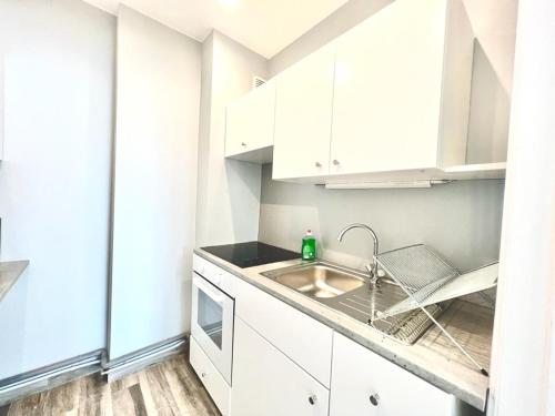 Η κουζίνα ή μικρή κουζίνα στο Cinquantenaire Appartement
