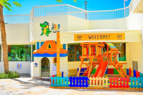 a building with a playground in front of a store at Steigenberger Hotel & Nelson Village, Taba in Taba
