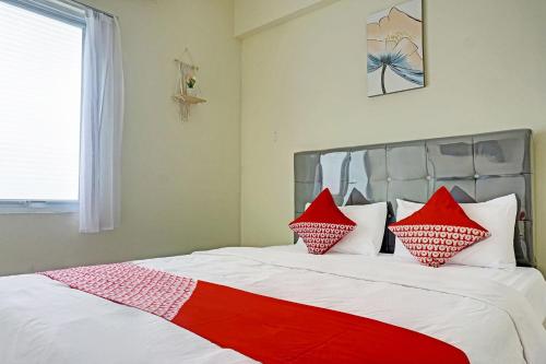 Легло или легла в стая в Super OYO 91139 Skyland Bogorienze Apartment