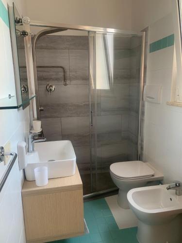 a bathroom with a sink and a toilet and a shower at Hotel Capri in San Benedetto del Tronto