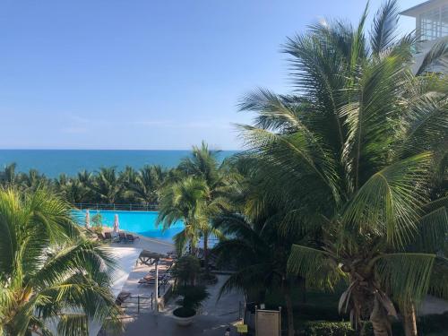 a view of the pool from the balcony of a resort at Hotel,Căn Hộ Mũi Né Sea link in Phan Thiet
