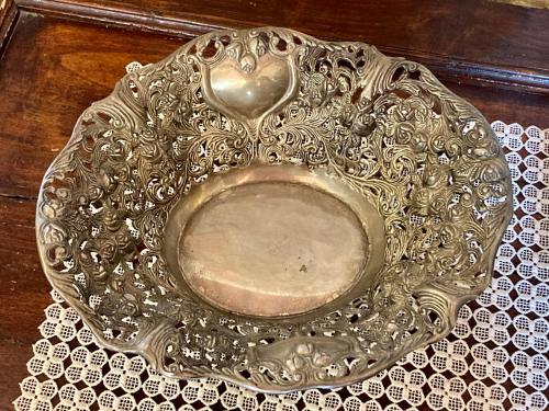 a silver bowl with a heart on a table at Monteriggioni Castello in Monteriggioni