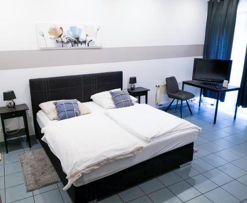 Postel nebo postele na pokoji v ubytování Hotel zur Schlemmerscheune