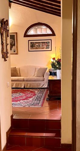 a living room with a couch and a table at Monteriggioni Castello in Monteriggioni