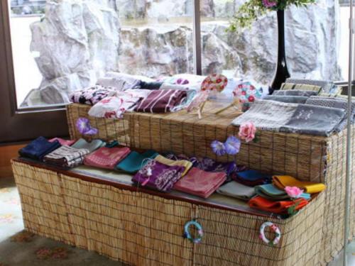two baskets filled with different types of pillows at Hotel Shion in Morioka