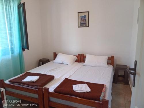 a bedroom with two beds with towels on them at Balkanska 22, Apartment in Krasici