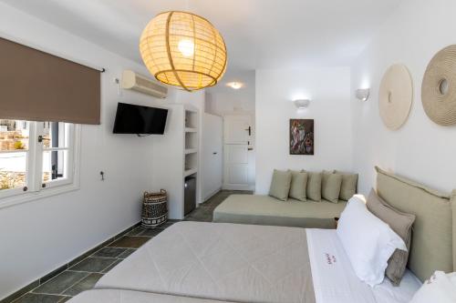 Un ou plusieurs lits dans un hébergement de l'établissement Nymfes Hotel