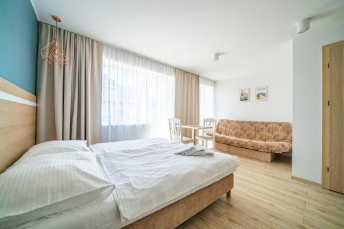 Postel nebo postele na pokoji v ubytování Willa Promyk