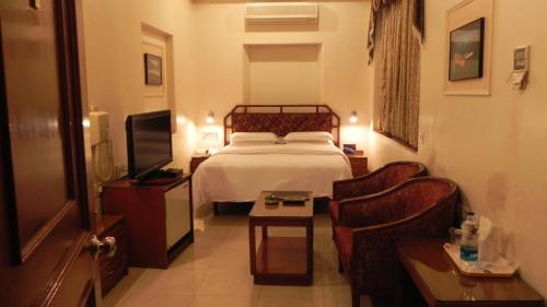 Ein Bett oder Betten in einem Zimmer der Unterkunft Hotel Aram