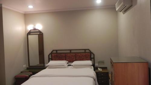 Ein Bett oder Betten in einem Zimmer der Unterkunft Hotel Aram