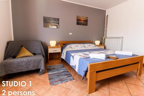 Postel nebo postele na pokoji v ubytování Glamour Apartments Vrsar