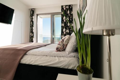 Posteľ alebo postele v izbe v ubytovaní BALTICUS APARTAMENT