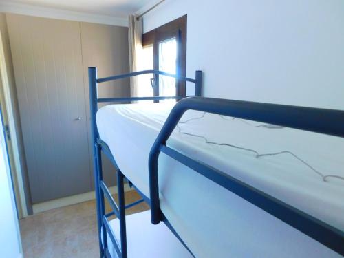 A bed or beds in a room at GMID IMMO Apartamento Punta Pelegrí