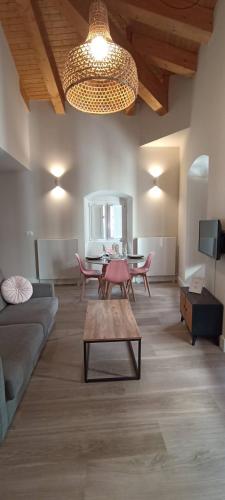 a living room with a couch and a table at La Rua 25 in Castro-Urdiales
