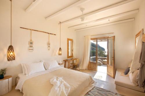 Ένα ή περισσότερα κρεβάτια σε δωμάτιο στο Kea Retreat