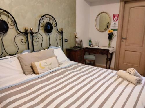 Ένα ή περισσότερα κρεβάτια σε δωμάτιο στο Bed and Breakfast Luna