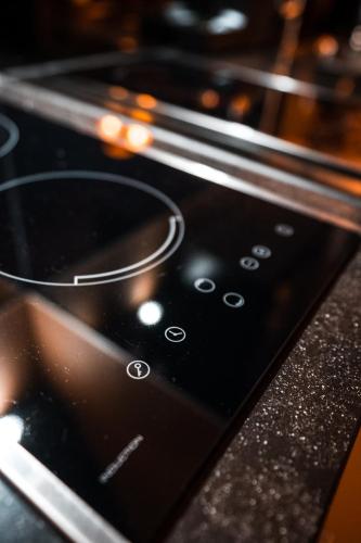 a close up of the control panel of an oven at Cosy Aquarium for a couple or friends in Groningen