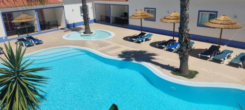 an image of a swimming pool at a resort at Casa Almeida in Vimieiro