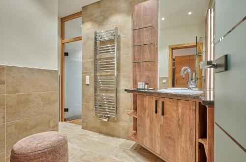 a bathroom with a sink and a mirror at Landhotel Schneider in Riedenburg