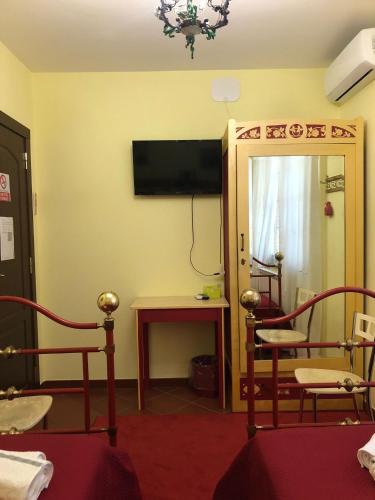 Телевизор и/или развлекательный центр в Villa Aurora