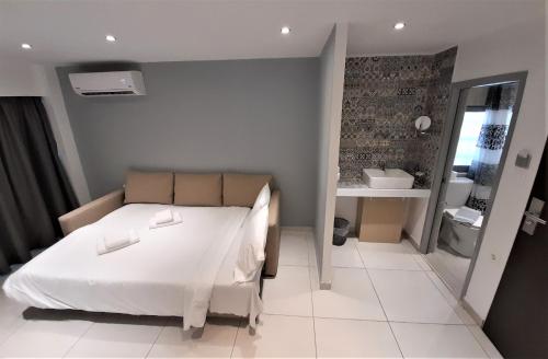 Postel nebo postele na pokoji v ubytování Elite Hotel