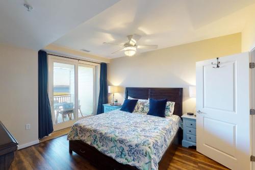 a bedroom with a bed with a view of the ocean at The Sanctuary - Sunset Haven B335 in Virginia Beach