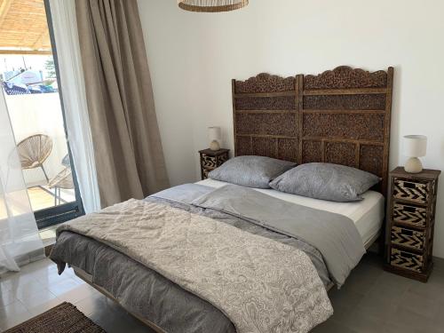 Säng eller sängar i ett rum på Casa Bamboo Tavira