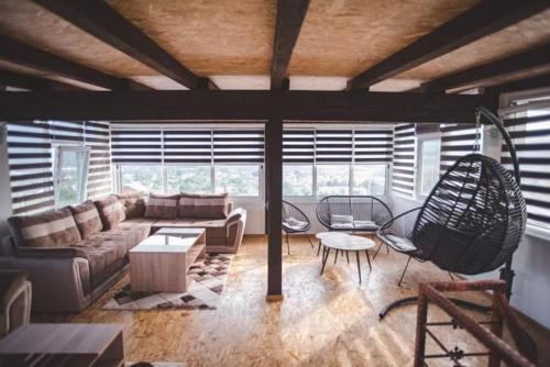 a living room with a couch and a table at Villa Vanesa Bihać in Bihać