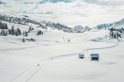 a snow covered mountain with a road in the snow at Mösslhof App Laite in San Vito