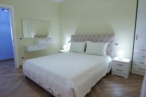 מיטה או מיטות בחדר ב-Kosta Apartments