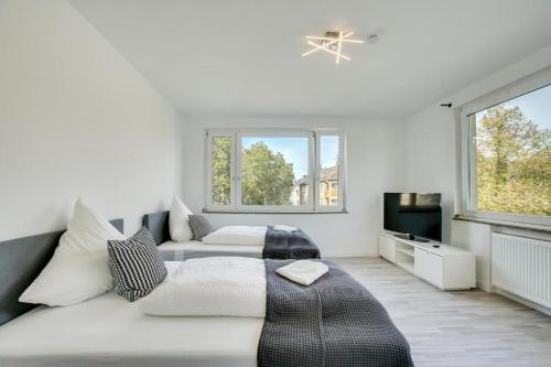Ένα ή περισσότερα κρεβάτια σε δωμάτιο στο Stay Here ND Apartments