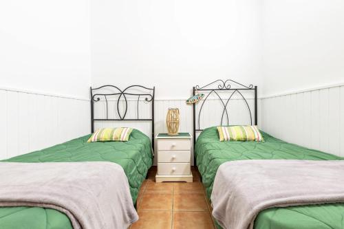 Кровать или кровати в номере Savoa Sea 365